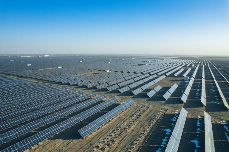 an aerial view of a large solar farm an aerial view of a large solar farm